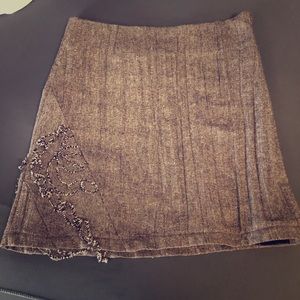 Cute brown mini skirt with detail on bottom corner